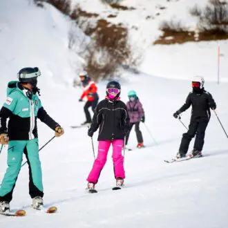 Group going down slope in Monte Pora
