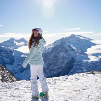 Girl on ski slope in Passo Tonale
