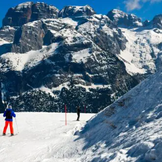 Winter activites at Pinzolo Ski Resort in Val Renda with a natural scene of great beauty: the Brenta Dolomites, Italy. Europe.