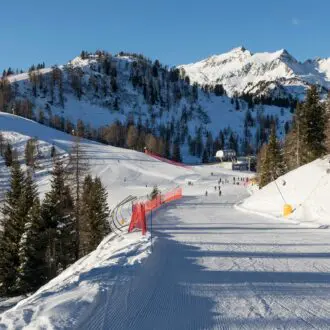 Skiing area in the Dolomites Alps in sunny day. Overlooking the Pista Mastellissima in Marilleva-Folgarida. Brenta. Italy