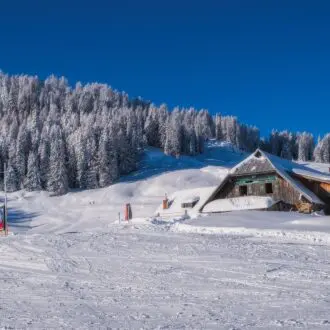 Mountain ski resort Nassfeld in sunny winter day. Carinthia, Austria.