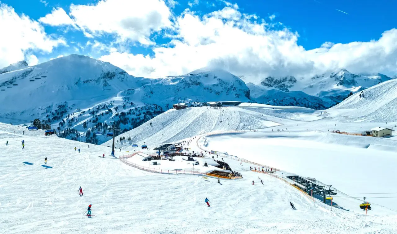 Obertauern, Salzburg area, Austria - Ski resort, hut, skiers and slope in Austrian Alps