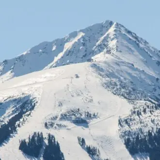 A scenic view of snow-capped Todorka Peak. Bansko, Bulgaria.