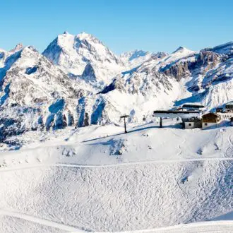 Landscape of ski slopes over French alps in winter resort Courchevel.